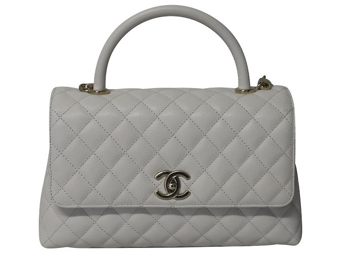 Bolsa Chanel Diamond acolchoada com alça superior em couro caviar branco
