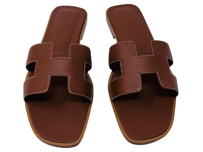 Hermès Sandals Oran HERMES GOLD NEW Brown Leather  ref.623472