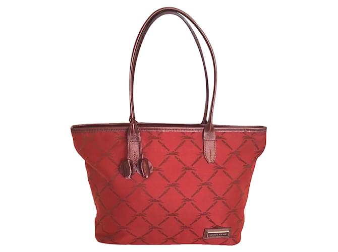 Longchamp Handbags Red Dark red Leather Cloth  ref.624519