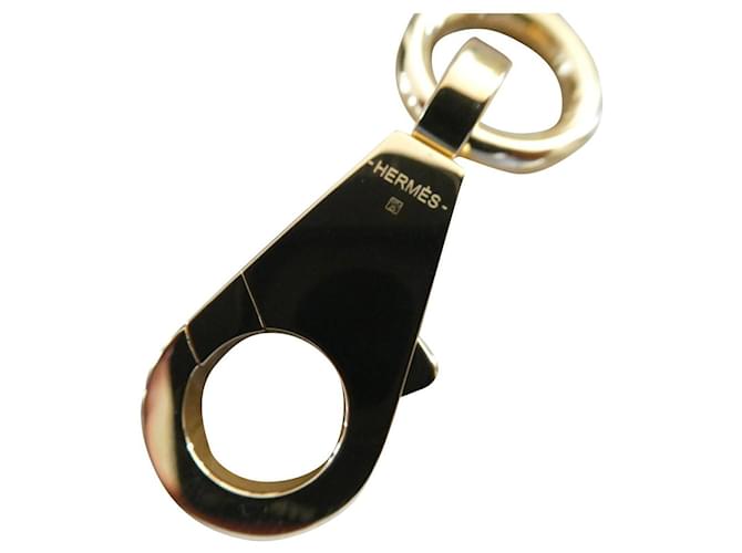 Hermès carabiner in new gold-plated steel Gold hardware  ref.625318