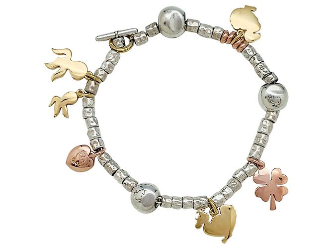 Dodo Pomellato Bracciale con ciondoli Dodo, argento e oro.