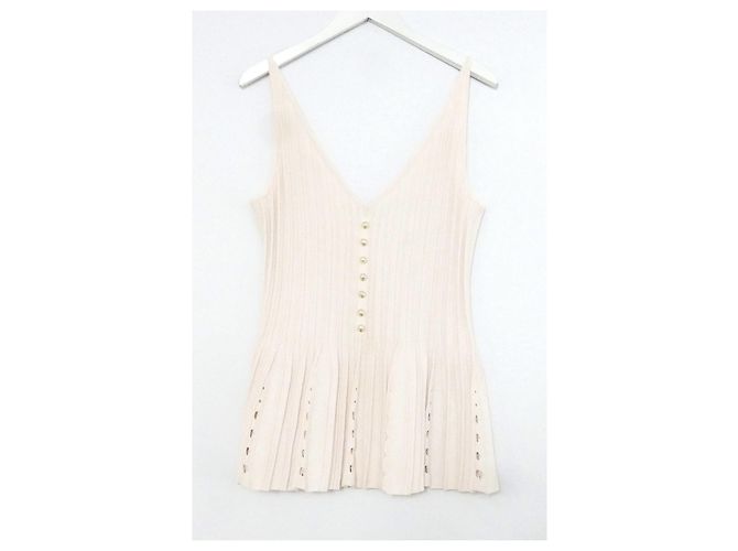 Chanel Spring 2012 Chaleco de punto con botones de perla y dobladillo peplum rosa