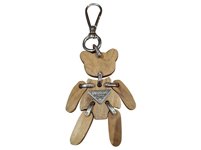 Magnifique bijoux de sac porte clés Prada Argenté Beige