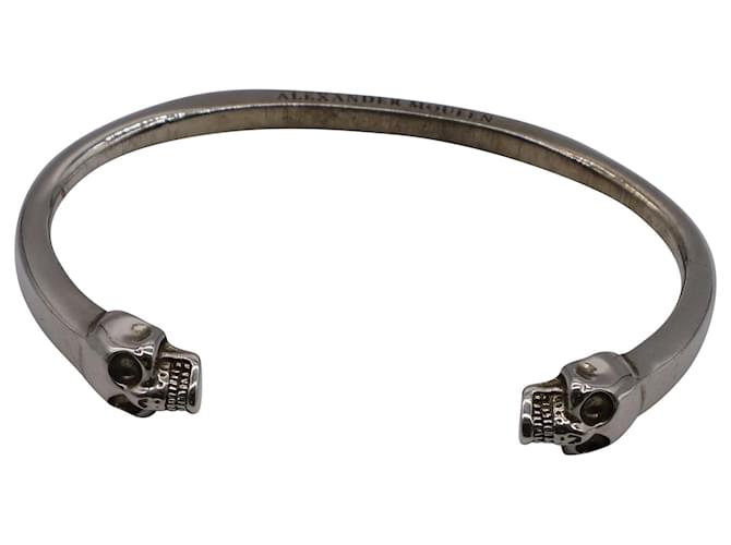 Alexander McQueen Twin Skull Manschettenarmband aus silberfarbenem Messing  ref.677595