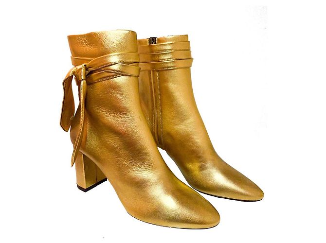 Botas Yves Saint Laurent Lou de piel dorada Dorado
