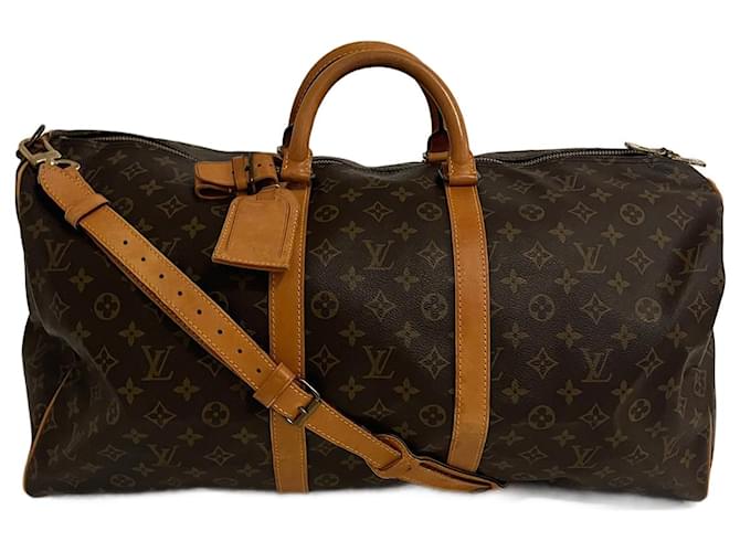 Louis Vuitton, Louis Vuitton coated canvas Vachetta leather keepall.  Condition: Authentic