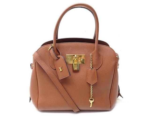 BOLSA DE MÃO LOUIS VUITTON MILLA MM EM CONHAQUE MARROM DE COURO GRAINADO  ref.699609