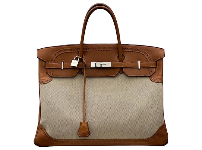 Hermès Handbags Light brown Leather Cloth  ref.712576
