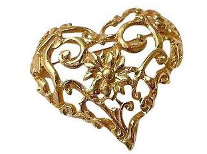 Broche Christian Lacroix dourada em aço