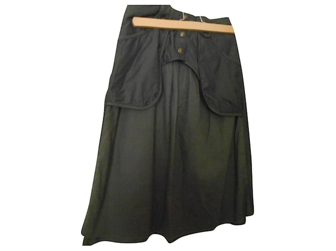 Ikks very beautiful khaki cotton and polyester viscose skirt with marked waist 34 US, ideal for 34/36 en dimensions: size 33 cm buttocks 40 cm hips 46 cm Length 65 cm lined skirt the superimposed top superb polyester fabrics the petticoat being in cotton pockets real brass buttons with logo beautiful cutout a little western in front  ref.762515