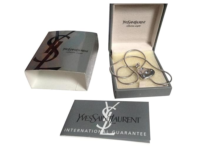 Yves Saint Laurent Pendant necklaces Silvery Silver  ref.773763