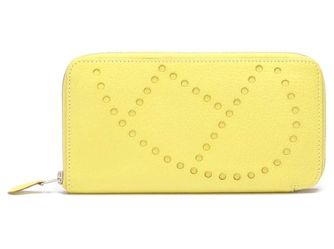 Hermès Cartera con cremallera de cuero Hermes Evelyne, cartera larga de cuero en buen estado Amarillo  ref.798271