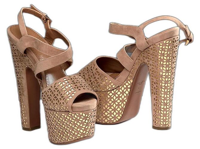 Sandali Alaïa in pelle oro e camoscio beige D'oro