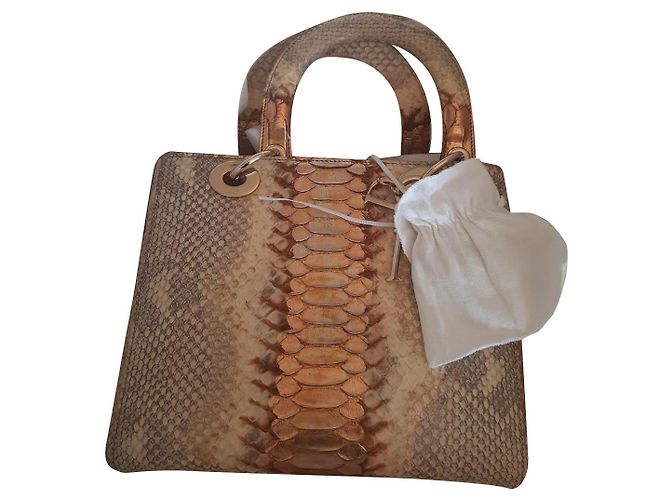 Christian Dior Lady Dior Gold em python Dourado