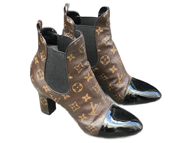 Louis Vuitton Black Leather Boots With Gold Detail in 2023