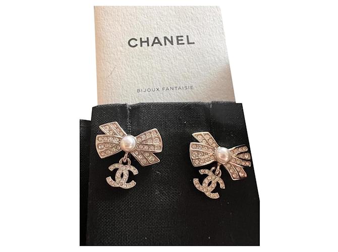 Chanel bows Silver hardware Metal  ref.868549