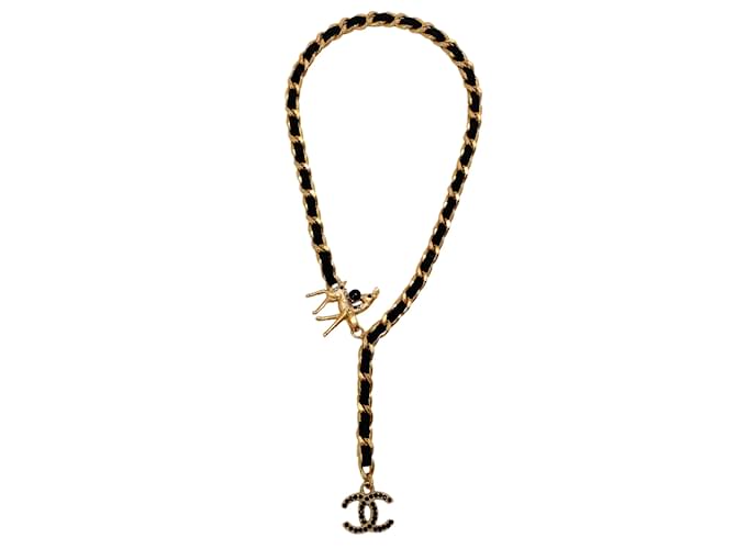 Chanel 2001 Collana in catena dorata e camoscio nero con chiusura cervo impreziosita da strass D'oro Metallo  ref.938895