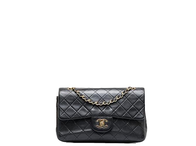 Chanel Black Quilted Caviar Small Classic Double Flap Bag – Madison Avenue  Couture