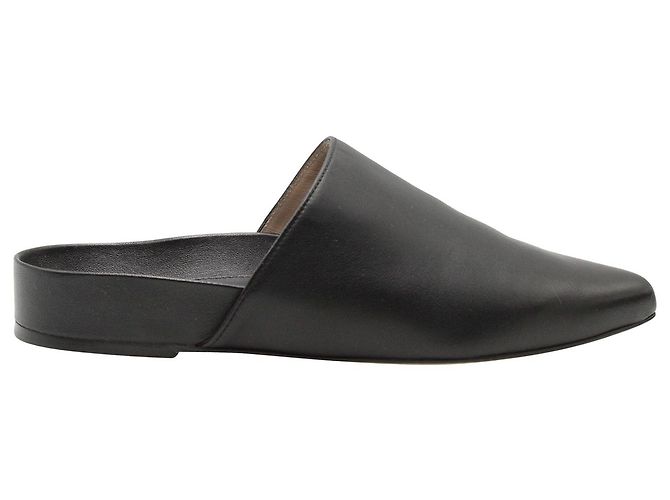 Stuart Weitzman Flat Mules in Black Leather