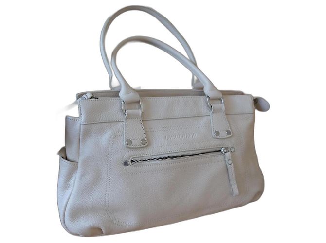 Bolso de mano Longchamp de piel graneada crema