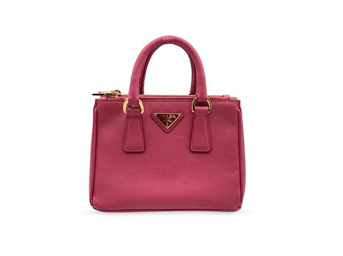 Prada Mini Logo-applique Top Handle Bag In Leather in Pink