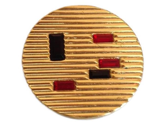Autre Marque Spilla tonda placcata oro con vetro nero e rubino D'oro