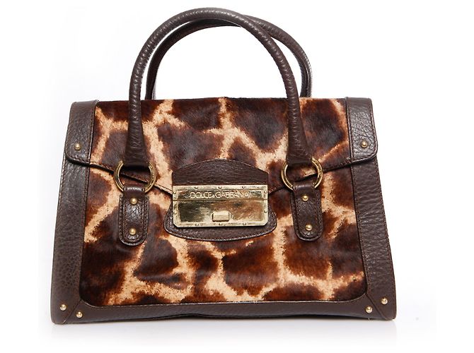 DOLCE & GABBANA, Bolsa com couro marrom e estampa de girafa em pelo de bezerro.