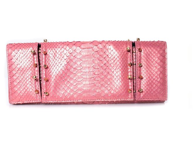 Autre Marque Maison Du Posh, Pochette con teschio piercing in pitone rosa.