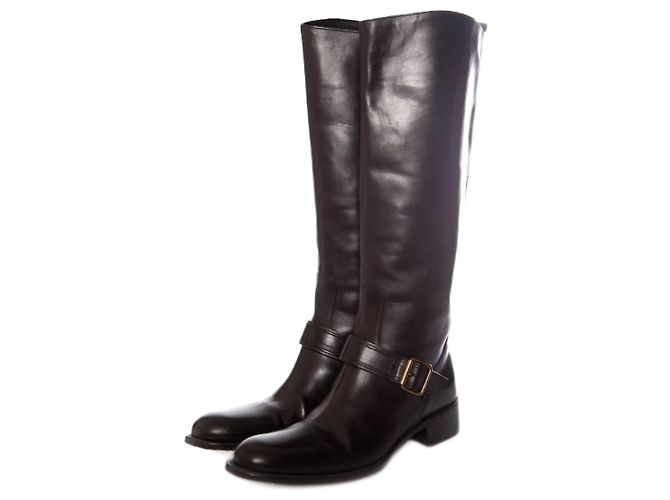 Sartore, botas de montar a caballo de cuero negro.