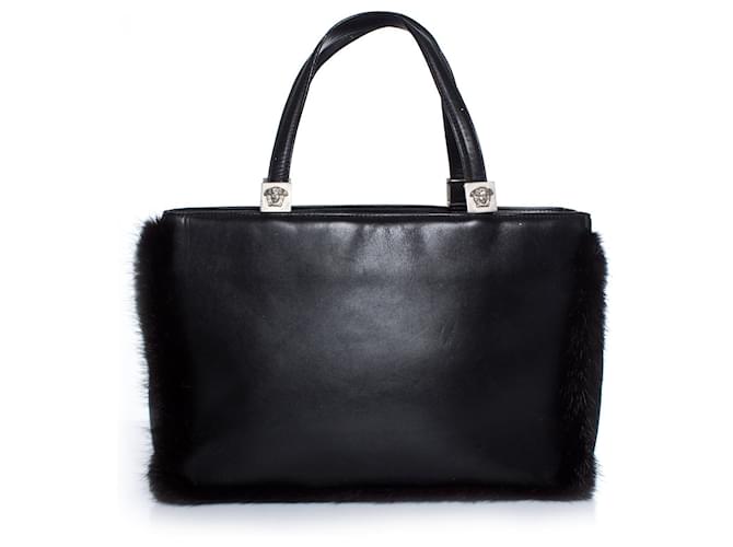 Gianni Versace, Vintage schwarze Lederhandtasche mit Fell  ref.1003292
