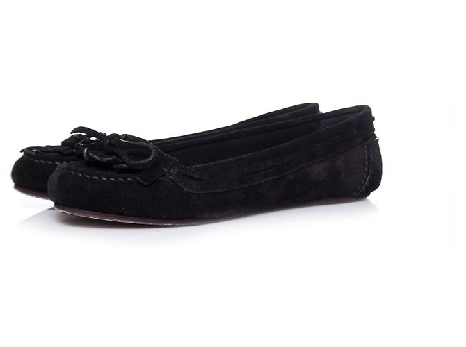 SAINT LAURENT, Mocassins à pompons en daim noir.