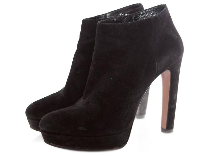 Prada, black suede platform boots.