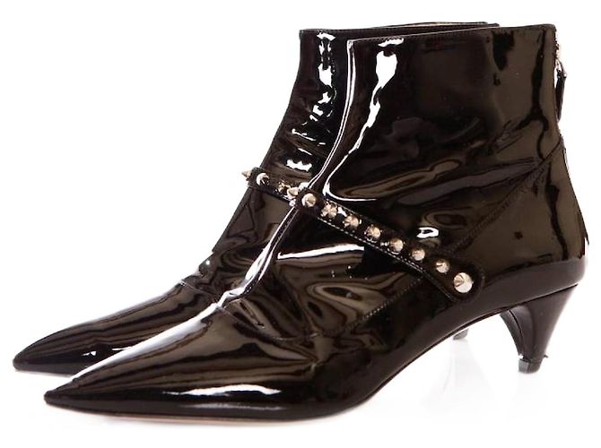 miu miu, black patent leather ankle boots with studs.