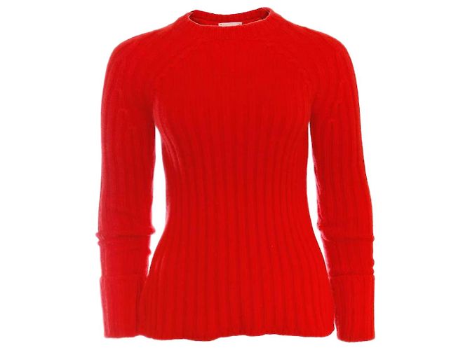 Laurence Dolige, roter Wollpullover.