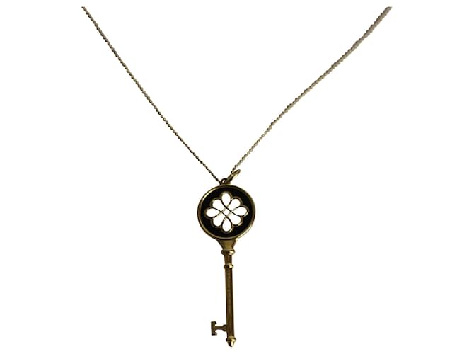 TIFFANY & CO. Collana a catena con ciondolo chiave margherita in metallo dorato e diamante D'oro  ref.1023070