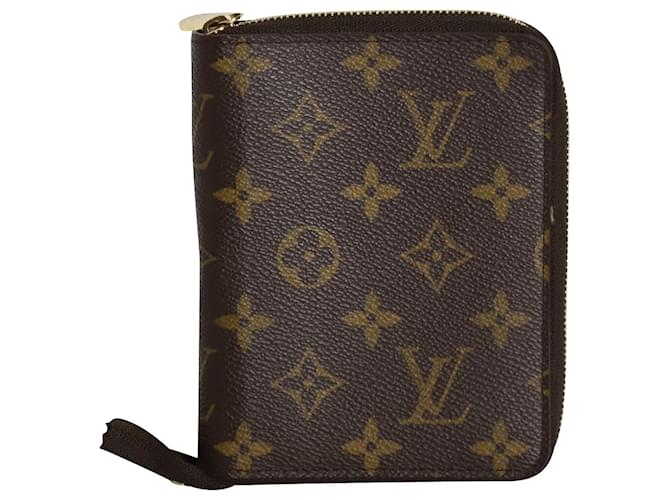 Portefeuille porte-passeport zippé Monogram Louis Vuitton en toile enduite marron  ref.1023144