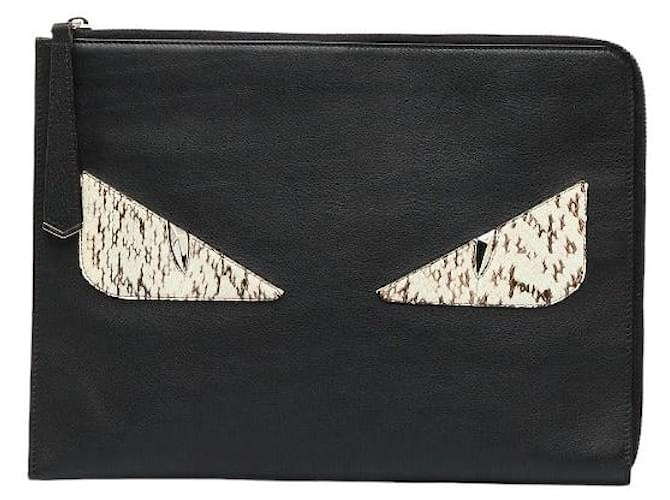 Sold at Auction: FENDI 'MONSTER' NAVY LEATHER EYE ACCENT POUCH