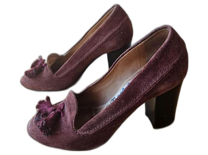 Mocasines Lanvin burdeos de piel con pompones de ante