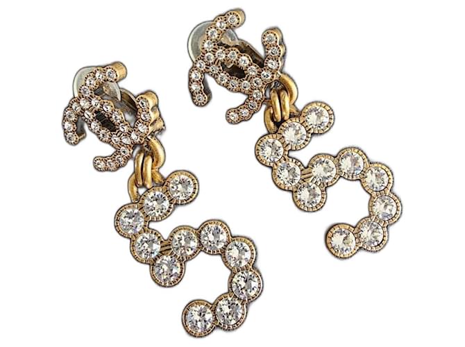 Chanel clips No.5 bronce y pedrería Metal  ref.1046824