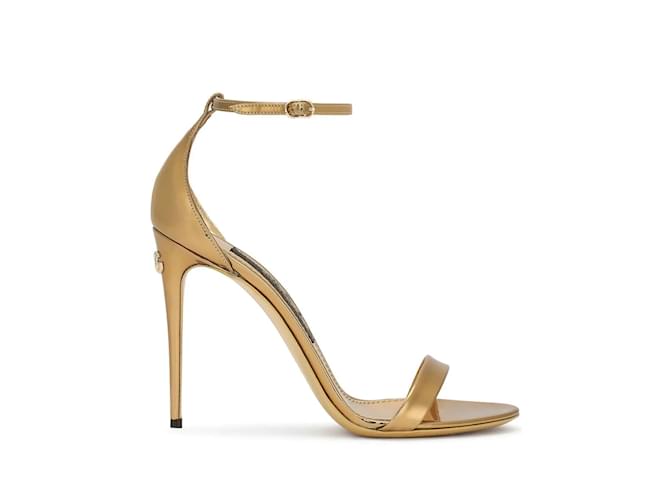 Runway Dolce & Gabbana Sandals  695 € VAT included Select size (Dolce & Gabbana Europe)  SCHEDULED DELIVERY  8 Nov - 9 nov Home - Women Dolce & Gabbana Shoes Runway Sandals Dolce & Gabbana Sandals Golden Leather  ref.1047566