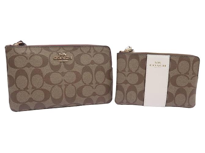NEUF LOT COACH 2 POCHETTES TOILE MONOGRAMME SIGNATURE NEW SET OF 2 POUCH Beige  ref.1055298