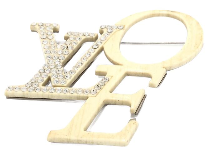 Alfinetes e broches Louis Vuitton Cru
