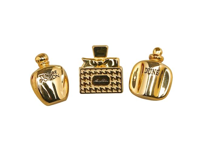 Insignia de pin en forma de botella de perfume Dior chapada en oro en excelente estado Dorado Metal  ref.1074190