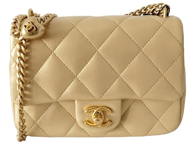 Bolsa Chanel Timeless Classique Mini Flap em couro dourado 23P  ref.1082972