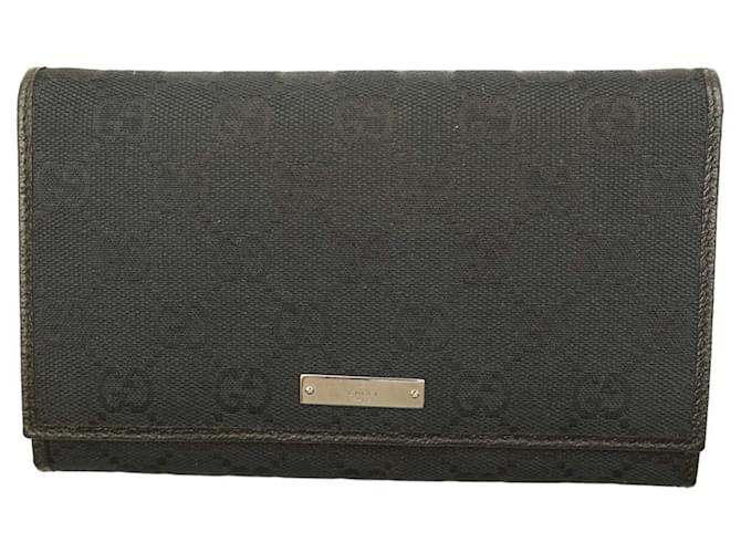 Gucci Bifold-Geldbörse mit schwarzem Signature-Canvas-Lederbesatz und Logo-Plakette  ref.1084862