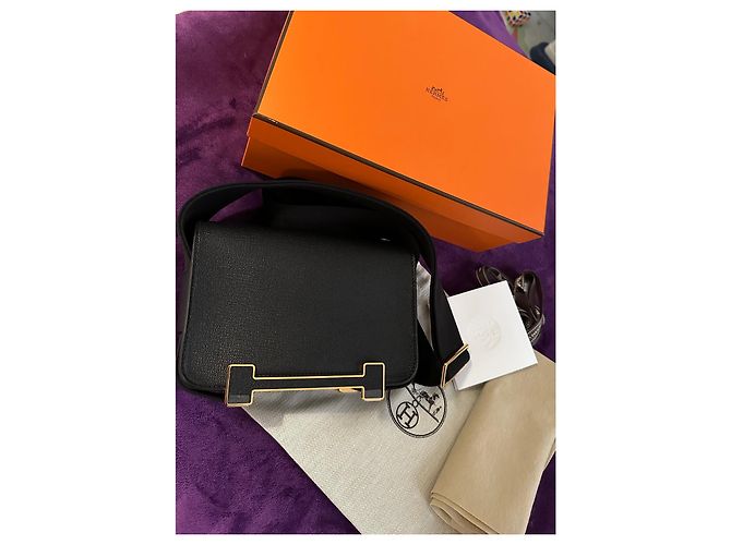 Sac à main Hermès Geta en cuir noir avec détails dorés
