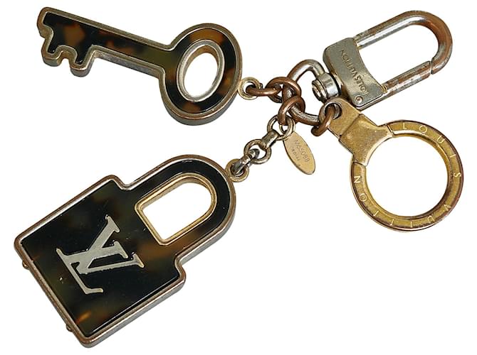 Porta-chaves e pingente de bolsa Louis Vuitton Gold Porte Cles Confidence Dourado Metal  ref.1123495