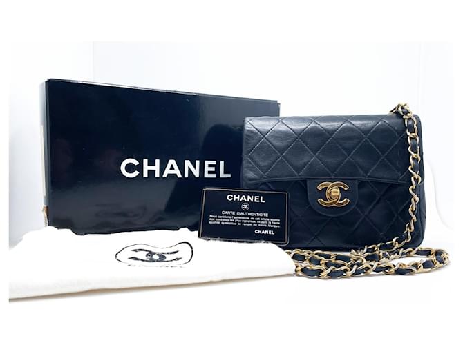 Bolso de mano Chanel Mini Timeless en cuero acolchado negro  ref.1130378