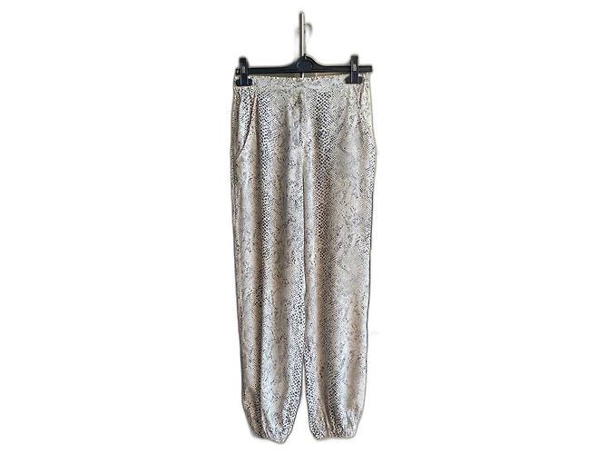 Pantalones Zimmermann de seda beige