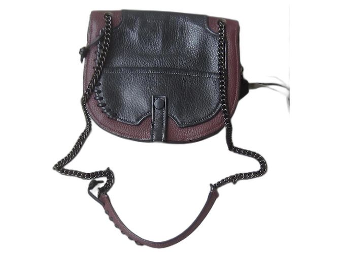 Bolsa Coach em couro granulado preto e bordô
